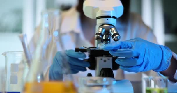 Researcher Adjusts Microscope Settings Analyzing Specimen Scientist Studies Composition Sample — Stock Video