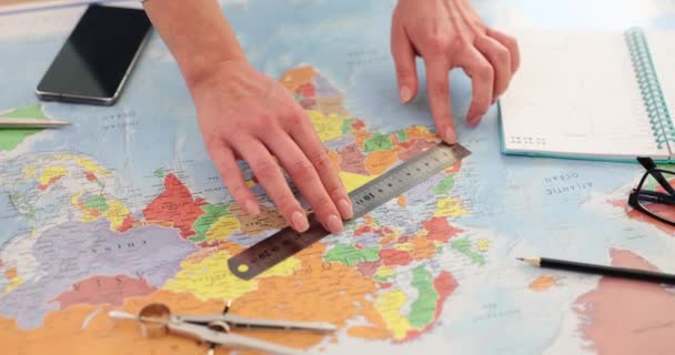 Woman Measures Distance Points World Map Ruler Table Travel Agent — Stock Video