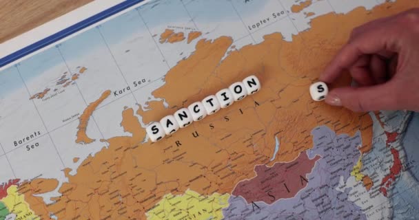Woman Adds Letter Word Sanctions Map Russia Expressing Condemning War — Stock Video
