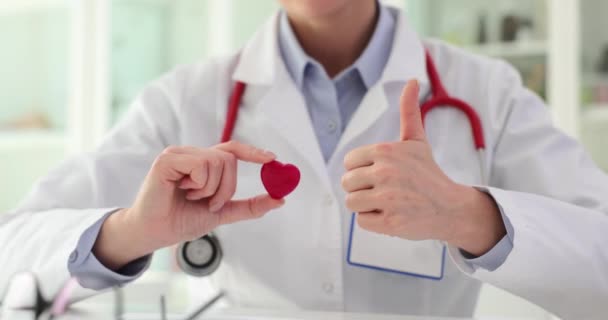 Physician Holds Miniature Heart Hand Young Doctor Demonstrates Thumb Gesture — Stock Video