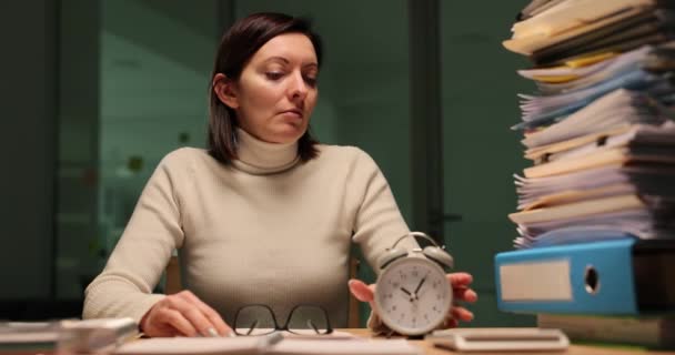 Tired Office Worker Overloaded Work Night Looks Alarm Clock Overtime — Stock Video