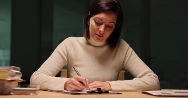 Woman Writing Financial Report Studying Desk Late Night Overtime Night — Stock Video