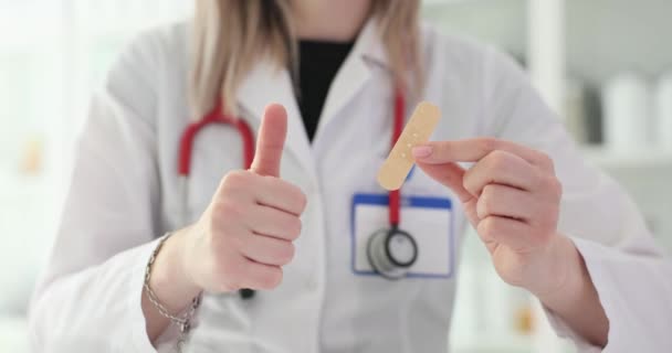 Doctor Shows Thumbs Holds Bandage Quality Wound Plaster — Stock Video