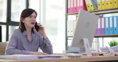 Employee talks to aggressive client on phone at workplace. Customer or employee shouts and swears on phone with female manager