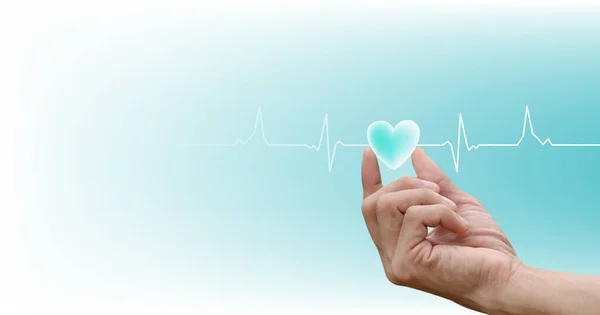 stock image Healthcare concept. heart-shaped on hand with the heartbeat line pulse rhythm icon on blue, white background.