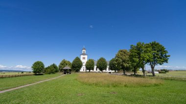 Rokstenen and the historic Rok kyrka. Located in ostergotland, Sweden, these iconic landmarks offer a unique glimpse into the Viking Age and the subsequent medieval period. clipart