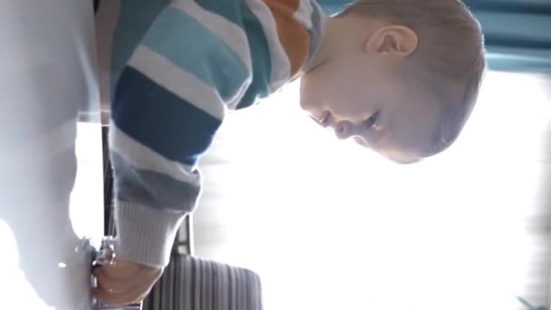 Mesmerizing Light Contrasts Little Boy Finds Joy Playfully Engages His — Stock Video