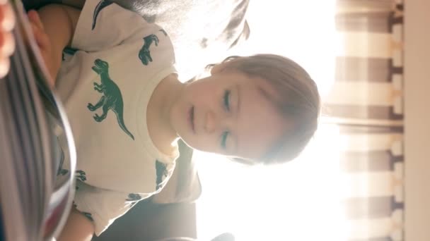 Little Boy Sits Couch Cozy Living Room Reading Book Doing — Stock Video