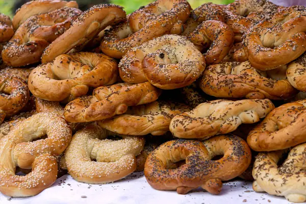 Stock image Freshly made homemade soft pretzels sprinkled with various seeds