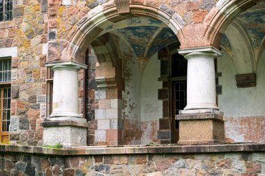 Restored castle in Cesvaine, Latvia. Terrace with columns clipart