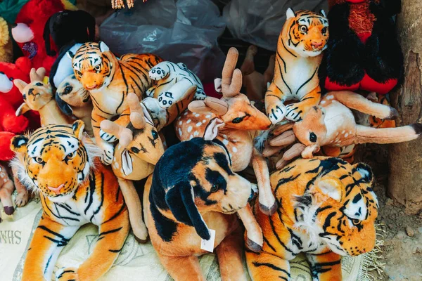 Group of stuffed animal toys kept for sale in street market
