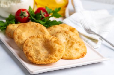 Delicious meat pie from Turkish cuisine. Fried handmade pies. Turkish name; fincan boregi or puf borek