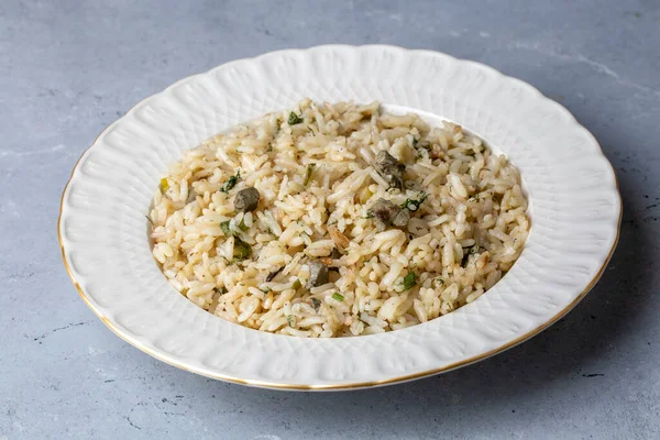 stock image Traditional delicious Turkish food; rice pilaf with pine nuts and currants (Turkish name; ic pilav or pilaf)