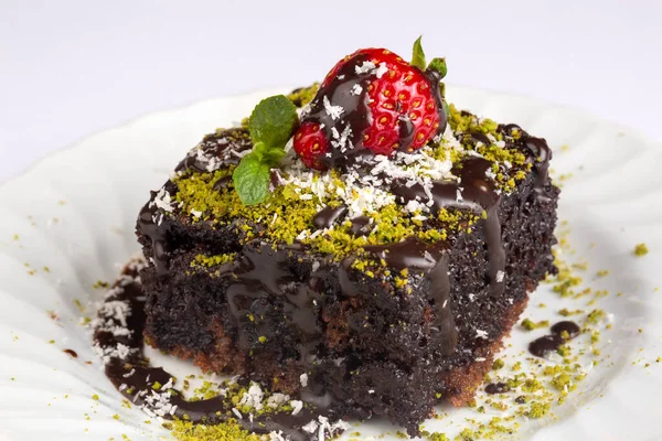Chocolate moist cake. Wet cake in a plate. Bakery products. (Turkish name; islak kek)