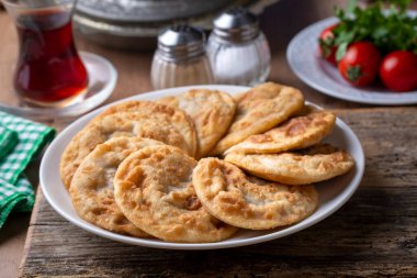 Delicious meat pie from Turkish cuisine. Fried handmade pies. Turkish name; fincan boregi or puf borek