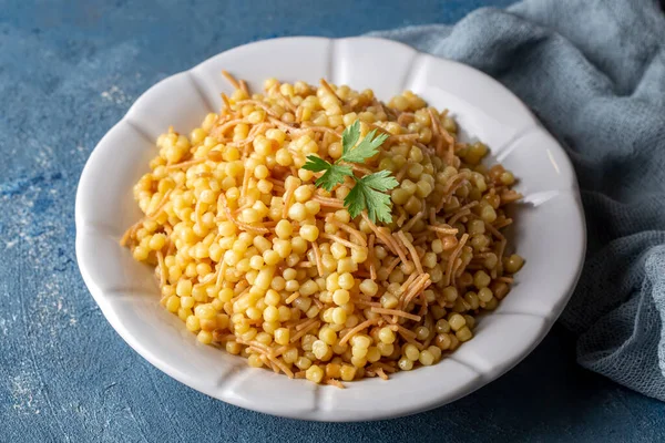 Stock image Traditional delicious Turkish food; Couscous pilaf with vermicelli (Turkish name; Sehriyeli kuskus pilavi)