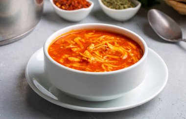 Chicken noodle soup with tomato. Turkish name; Domatesli tavuklu sehriye corbasi