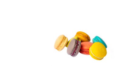 Colorful macaroon cakes. Small french muffins. Colorful macarons on a white background