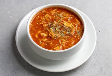 Chicken noodle soup with tomato. Turkish name; Domatesli tavuklu sehriye corbasi