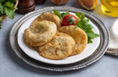 Delicious meat pie from Turkish cuisine. Fried handmade pies. Turkish name; fincan boregi or puf borek