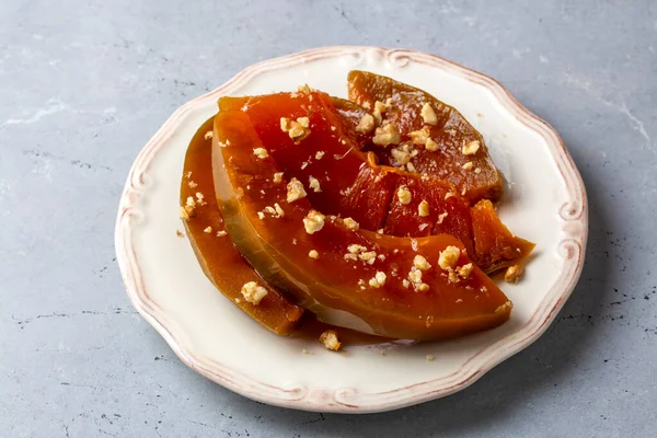 stock image Traditional delicious Turkish cuisine; Pumpkin dessert or jam (Turkish name; Kirecte kabak receli or kabak tatlisi)