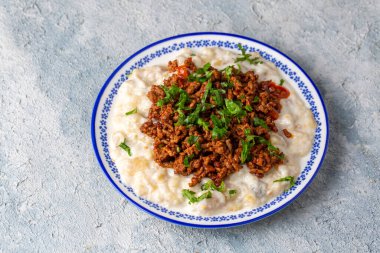 Turkish Ali Nazik Kebab with Yogurt, Minced Meat and Roasted Eggplant or Aubergine Kebap.