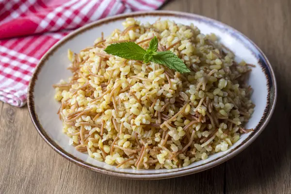 stock image Traditional delicious Turkish food; bulgur pilaf with chickpea (Turkish name; nohutlu bulgur pilavi)