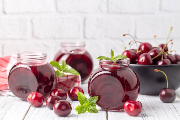 Jars with freshly homemade cherry jam, sour cherry jam, Turkish name; Visne receli