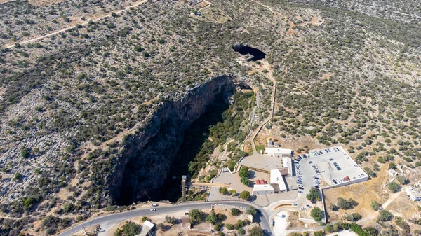 Heaven and hell (Cennet and Cehennem) are two large sinkholes, There is a chapel in paradise cave. Aerial view drone shooting, Mersin Province, Turkey