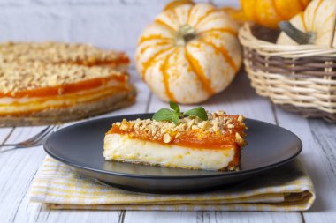 Handmade delicious pumpkin cheesecake and small pumpkins, Turkish name; balkabakli cheesecake. Pumpkin dessert.