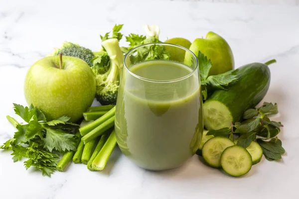 A glass of green celery juice. Celery drink prepared for healthy nutrition and detox.