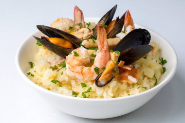 Mediterranean risotto with shrimps, mussels, octopus and clams. Seafood risotto