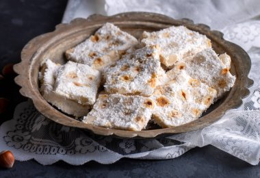 Traditional delicious Turkish dessert; cezerye with hazelnuts and coconut (Turkish name; Findikli madonna)