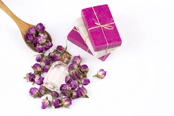 Dried pink rose flowers and rose soap
