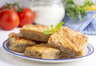 Handmade Greek spring rolls with cheese, sliced into squares. Turkish name; el yapimi tepsi boregi clipart