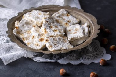 Traditional delicious Turkish dessert; cezerye with hazelnuts and coconut (Turkish name; Findikli madonna)