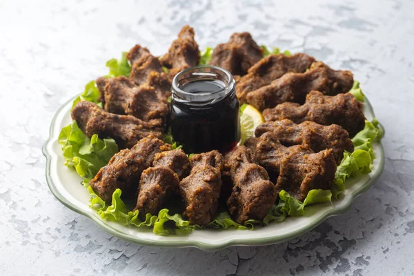 Traditional delicious Turkish food; Turkish name; Cig kofte (raw meatball in Turkish) with lettuce