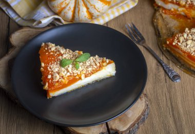 Handmade delicious pumpkin cheesecake and small pumpkins, Turkish name; balkabakli cheesecake. Pumpkin dessert.