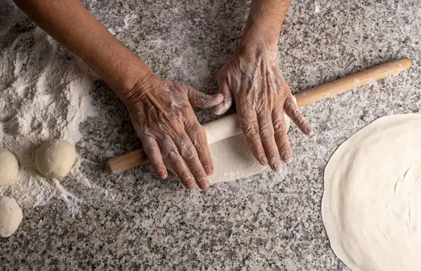 Making bread with a rolling pin, yeast dough, Turkish style