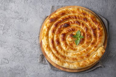 Traditional Turkish pastry with spinach. (Turkish Name: Ispanakli Kol Boregi, Bosnak boregi). Handmade pastry with spinach filling.