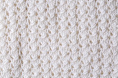 Örülmüş doku. Yünden desenli kumaş. Arka plan, kopyalama alanı. El yapımı süveter deseni, yün örgü deseni