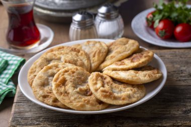 Delicious meat pie from Turkish cuisine. Fried handmade pies. Turkish name; fincan boregi or puf borek