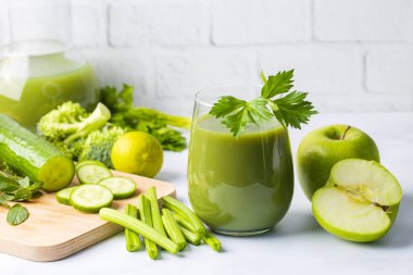 A glass of green celery juice. Celery drink prepared for healthy nutrition and detox.