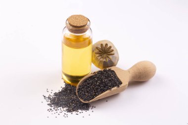 Küçük bir kavanozda gerekli yağlı haşhaş tohumları