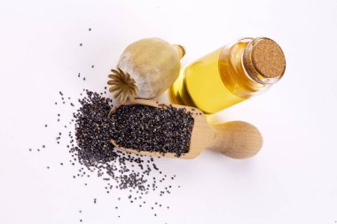 Küçük bir kavanozda gerekli yağlı haşhaş tohumları