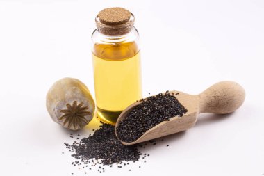 Küçük bir kavanozda gerekli yağlı haşhaş tohumları