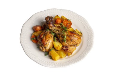 Baked chicken thighs and fried potatoes look delicious.