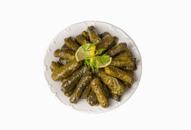 Delicious dolma (sarma) stuffed grape leaves rice. Lebanese dolma sarma on plate. Lebanon turkish greek middle eastern cuisine. (Turkish name; Yaprak sarma) clipart