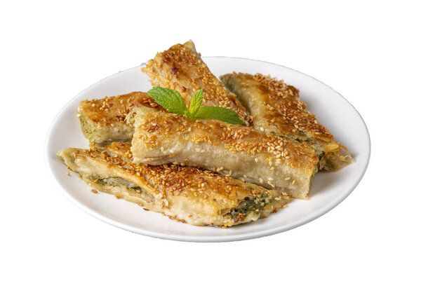 Greek cuisine dishes; spanakopita Sesame on handmade spinach feta cheese pie in the oven. Turkish name; ispanakli borek