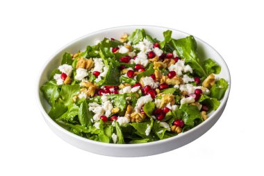 Ceviz ve nar ile servis edilen peynirli Arugula salatası. Türkçe adı: Roka salatasi